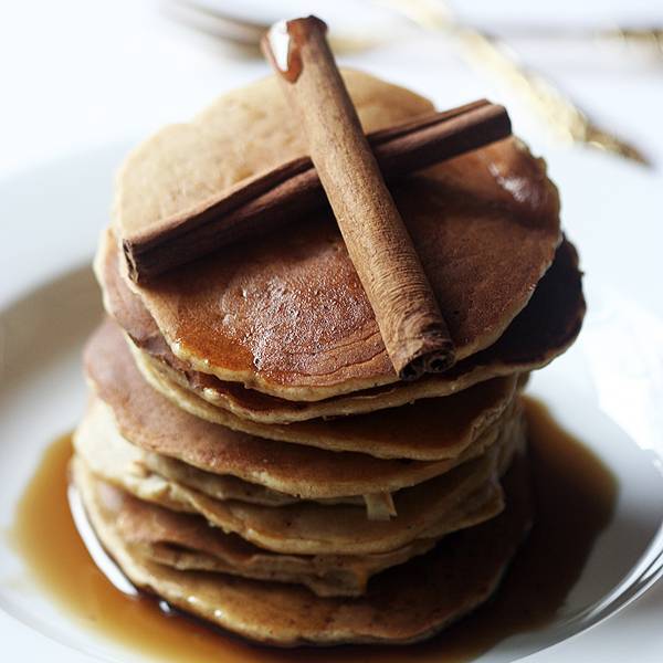 Gluten free pumpkin pancakes with maple syrup